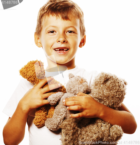 Image of little cute boy with many teddy bears hugging isolated close up