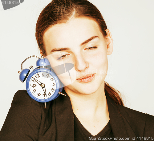 Image of young beauty woman in business style costume waking up for work 