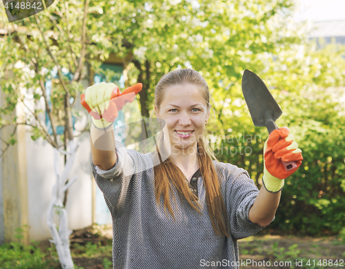 Image of young woman gardener