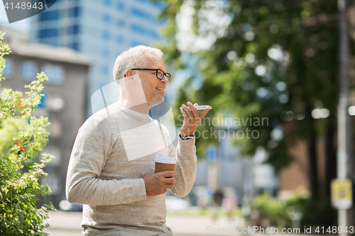 Image of old man using voice command recorder on smartphone