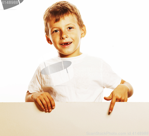 Image of little cute boy holding empty shit to copyspace isolated close u