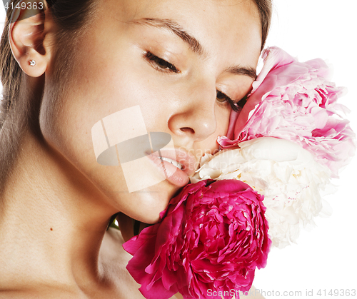 Image of young beauty woman with flower peony pink closeup makeup soft te