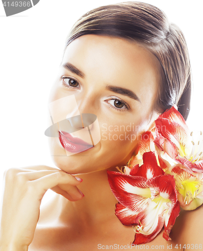 Image of young pretty brunette woman with red flower amaryllis close up i