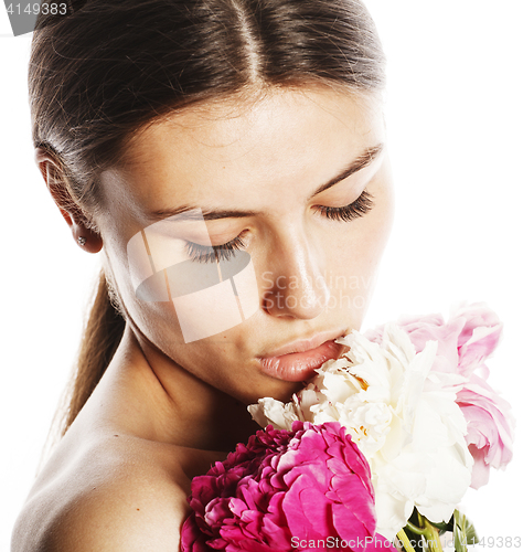 Image of young beauty woman with flower peony pink closeup makeup soft te