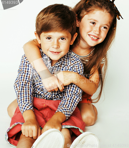 Image of little cute boy and girl hugging playing on white background, happy family close up isolated, lifestyle people concept