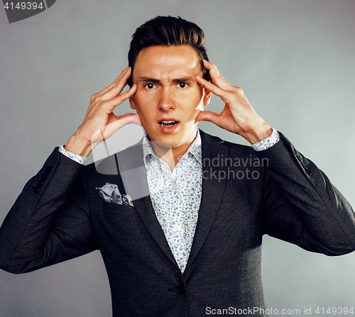 Image of young pretty business man standing on white background, modern hairstyle, posing emotional, lifestyle people concept