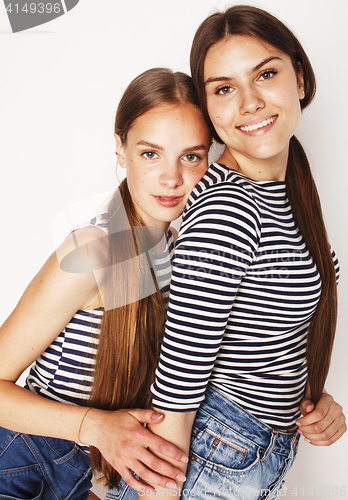 Image of two cute teenagers having fun together isolated on white