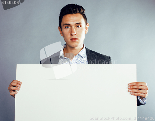 Image of young pretty business man standing on white background, modern hairstyle, posing emotional, lifestyle people concept