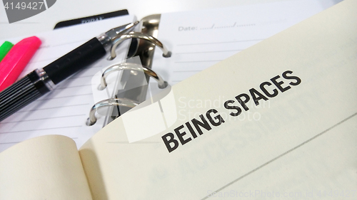 Image of Being spaces words on a book