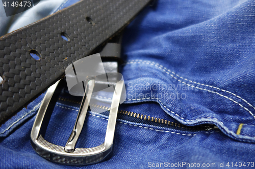 Image of Blue jeans with black leather belt 