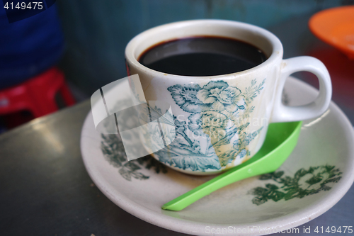 Image of Steaming traditional oriental Chinese style dark coffee