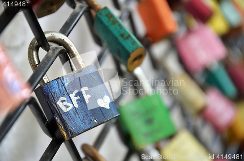 Image of Best friend forever padlocks locked on iron chain