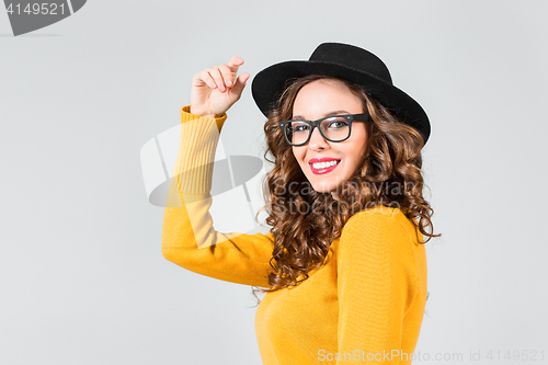 Image of The girl in glasses and hat