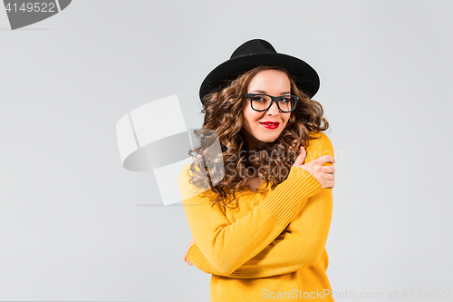 Image of The girl in glasses and hat