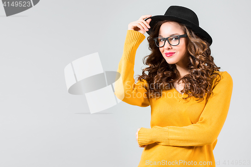 Image of The girl in glasses and hat
