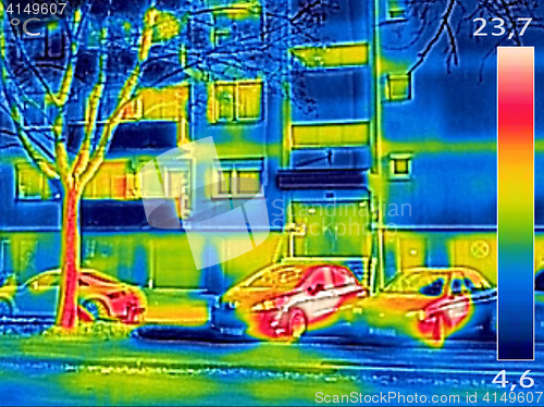 Image of Thermal image showing parked cars in front of the apartment buil