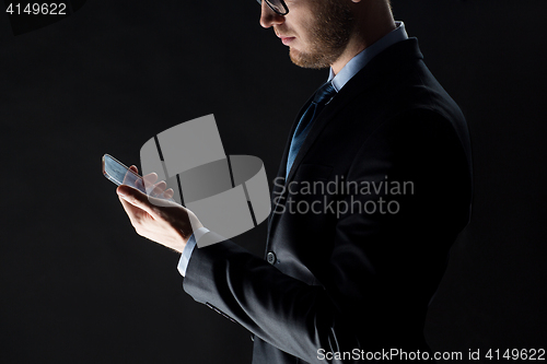 Image of close up of businessman with glass smartphone