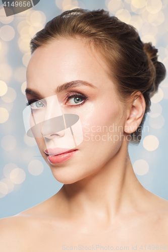 Image of beautiful young woman face over white background