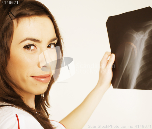 Image of close up portrait of young doctor with x ray shot in hands