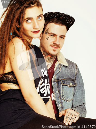 Image of Young couple together making love, hugging. guy with tattoo, gir