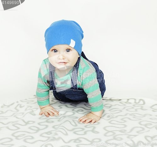 Image of little cute baby toddler on carpet isolated close up smiling adorable