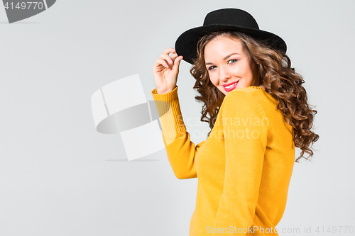 Image of The smiling girl and hat