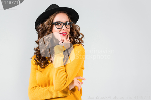 Image of The girl in glasses and hat