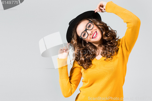 Image of The girl in glasses and hat