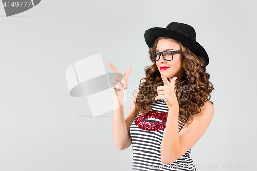 Image of The girl in glasses and hat