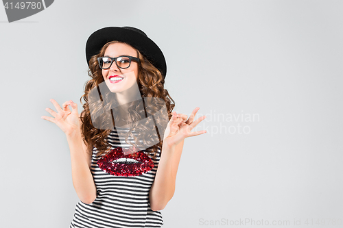 Image of The girl in glasses and hat