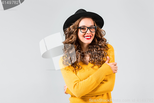 Image of The girl in glasses and hat