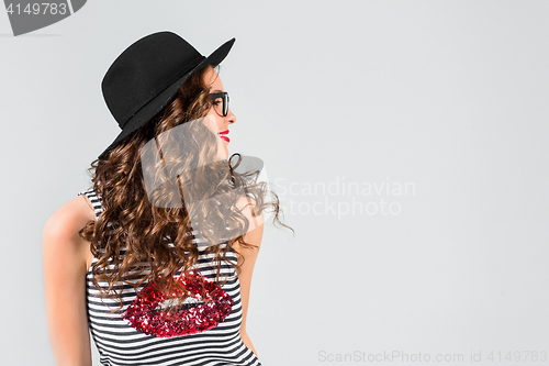 Image of The girl in glasses and hat