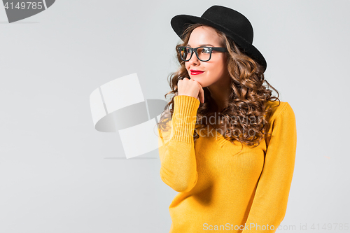 Image of The girl in glasses and hat