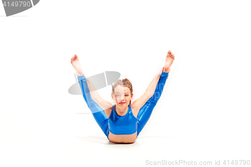 Image of The teenager girl doing gymnastics exercises isolated on white background