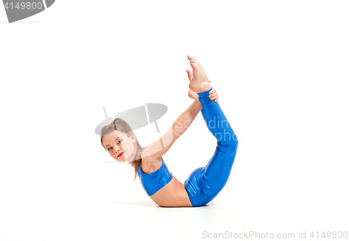 Image of The teenager girl doing gymnastics exercises isolated on white background