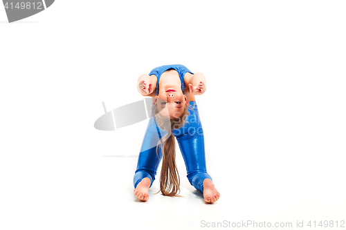 Image of The teenager girl doing gymnastics exercises isolated on white background