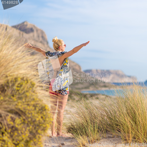 Image of Free Happy Woman Enjoying Sun on Vacations.