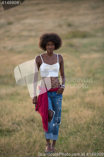 Image of young black woman in nature