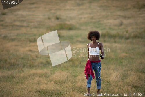 Image of young black woman in nature