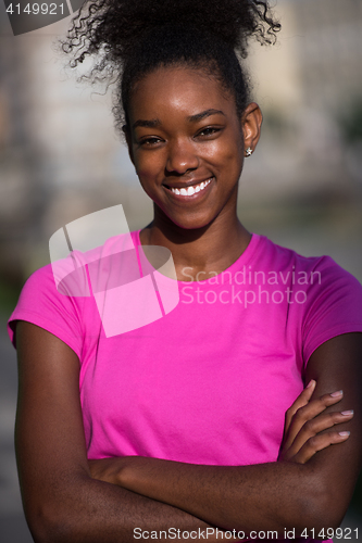 Image of Portrait of sporty young african american woman running outdoors