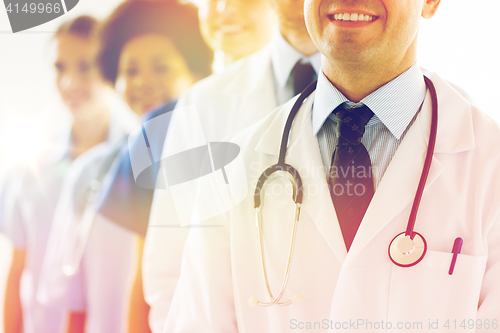 Image of close up of happy doctors with stethoscope