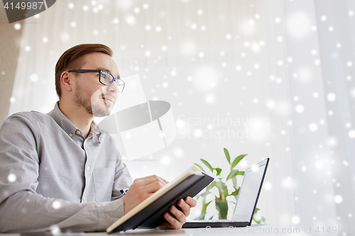 Image of creative male worker or businessman with notebook