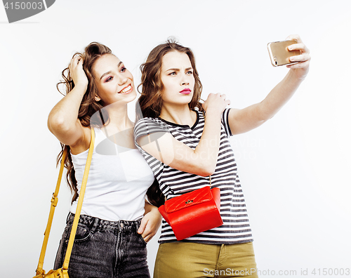 Image of two best friends teenage girls together having fun, posing emotional on white background, besties happy smiling, making selfie, lifestyle people concept