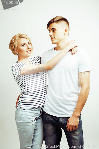 Image of young pretty teenage couple, hipster guy with his girlfriend happy smiling and hugging isolated on white background, lifestyle people concept