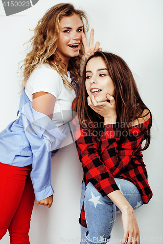 Image of two best friends teenage girls together having fun, posing emotional on white background, besties happy smiling, making selfie, lifestyle people concept