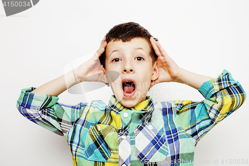 Image of young pretty little boy kid wondering, posing emotional face isolated on white background, gesture happy smiling close up, lifestyle people concept