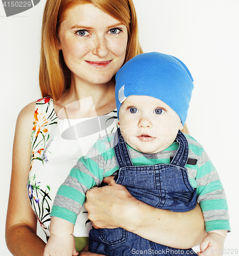 Image of young beauty mother with cute baby, red head happy modern family