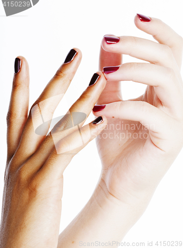 Image of two different nathion manicured hands on white isolated, african