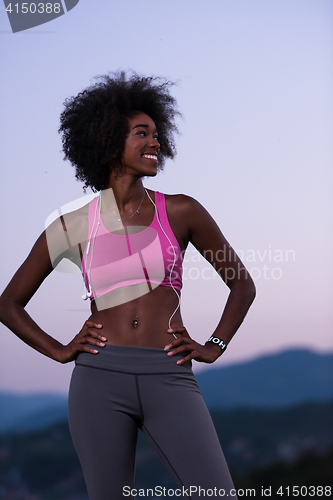 Image of portrait of african american woman jogging in nature