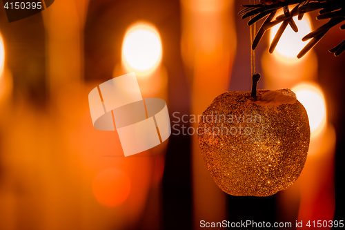 Image of Glittering Xmas apple on a tree